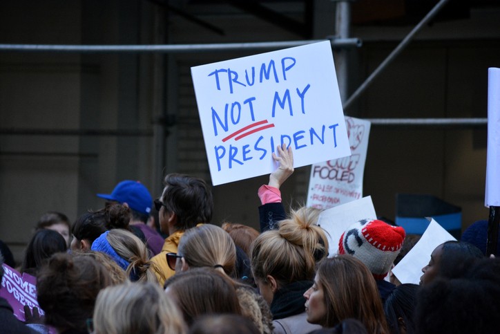 New York, New York - November 12, 2016: Protester carrying a sign while marching in a Trump is not my President rally in response to the 2016 Presidential Election of Donald Trump in New York City in 2016.