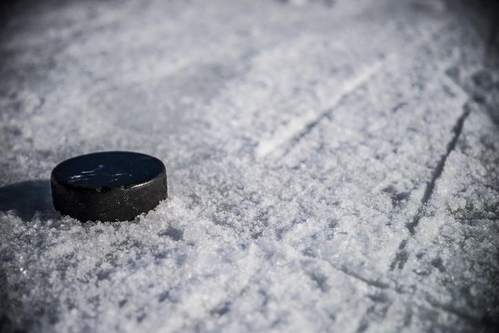 Hockey Puck on Chewed Ice with Skate Marks