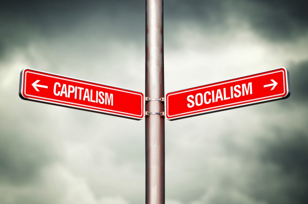 Capitalism or Socialism concept. Street sign pointing to opposite direction. Choose between.