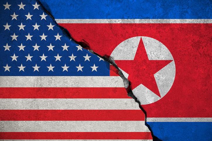 north korea flag on broken brick wall and half usa united states of america flag, crisis trump president and north korean for nuclear atomic bomb risk war concept