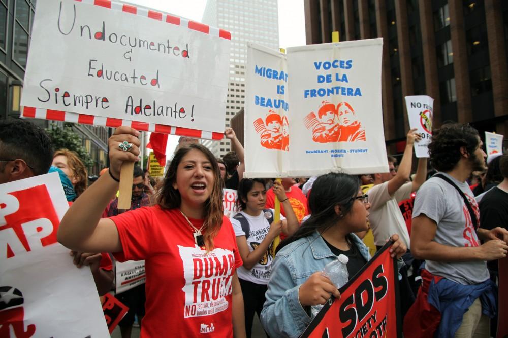 Cleveland, Ohio, USA - July 18, 2016:  Young Hispanics support the Dream Act at the Stop Trump march on the first day of the Republican National Convention.  DACA (the Deferred Action for Childhood Arrivals) program defers immigration enforcement action against young people brought to the U.S. illegally as children.