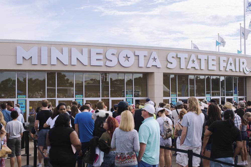 Minneapolis, United States - September 3, 2016: Crowd of people gathering around ticket booth at the last weekend of the Minnesota State Fair. 