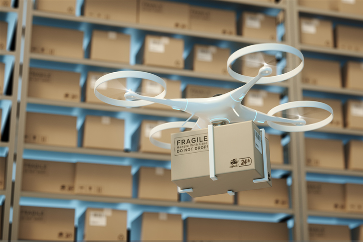 Drones carry express packages in warehouses.Packages are transported in high-tech Settings,online shopping,Concept of automatic logistics management.3d rendering warehouse.