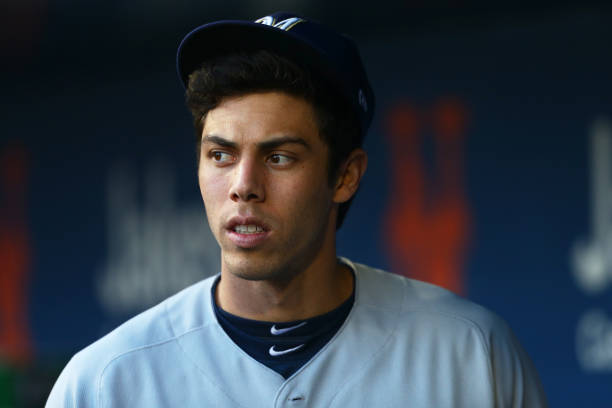 NEW YORK, NEW YORK - APRIL 27:  Christian Yelich #22 of the Milwaukee Brewers looks on from the dugout prior to the start of the game against the New York Mets at Citi Field on April 27, 2019 in New York City. Milwaukee Brewers defeated the New York Mets 8-6. (Photo by Mike Stobe/Getty Images)