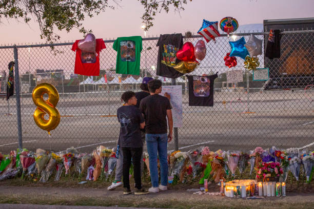 TOPSHOT - Seventeen years old local high School friends who attended the Travis Scott concert, Isaac Hernandez and Matthias Coronel watch Jesus Martinez sign a remembrance board at a makeshift memorial on November 7, 2021 at the NRG Park grounds where eight people died in a crowd surge at the Astroworld Festival in Houston, Texas. - Authorities in Texas opened a criminal investigation Saturday into a tragedy in which the crowd at a huge Travis Scott rap concert surged toward the stage in a crush that killed eight people and sent dozens to the hospital.
Around 50,000 people were in the audience at Houstons NRG Park Friday night when the crowd started pushing toward the stage as Scott was performing, triggering chaotic scenes. (Photo by Thomas Shea / AFP) (Photo by THOMAS SHEA/AFP via Getty Images)